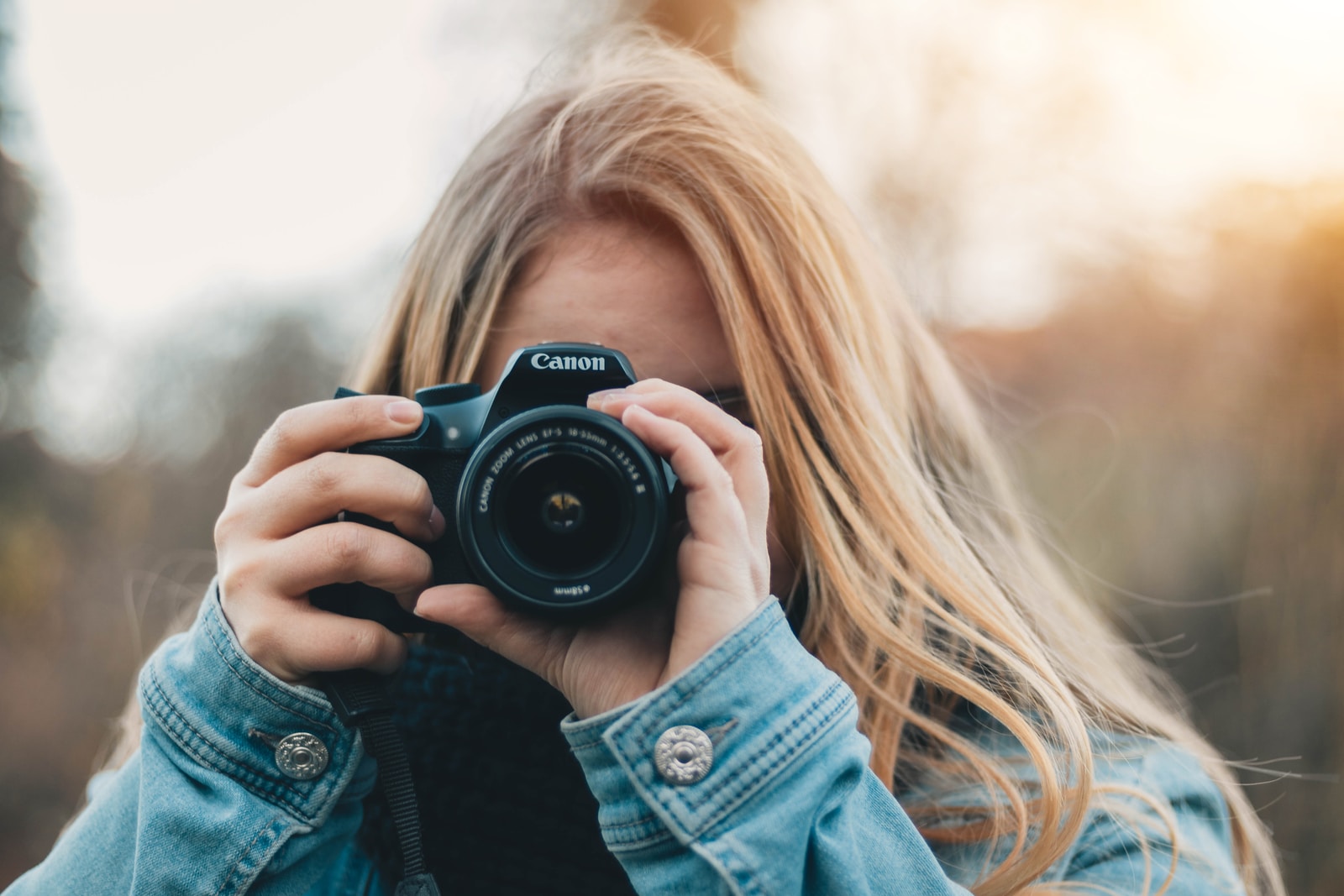 woman taking photo during daytime