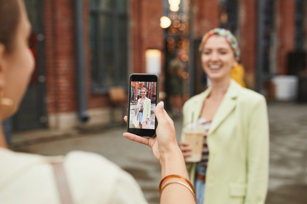 Woman Taking Picture of Her Friend