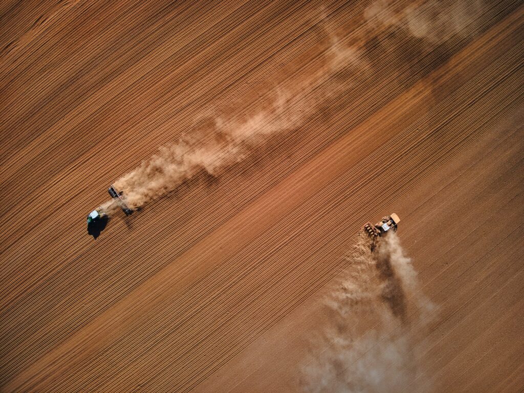 white and black airplane on brown sand during daytime