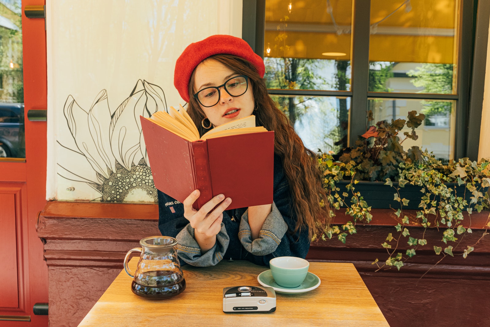 A Woman With a Beret Reading a Book