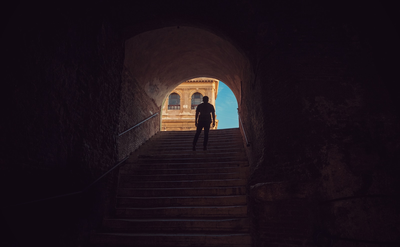man standing on stairs