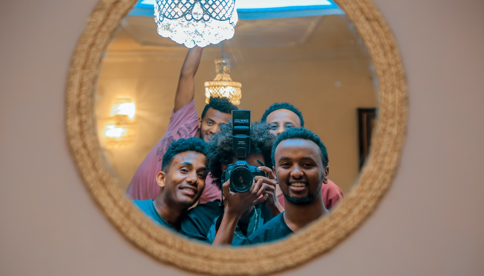 group of people taking mirror photo