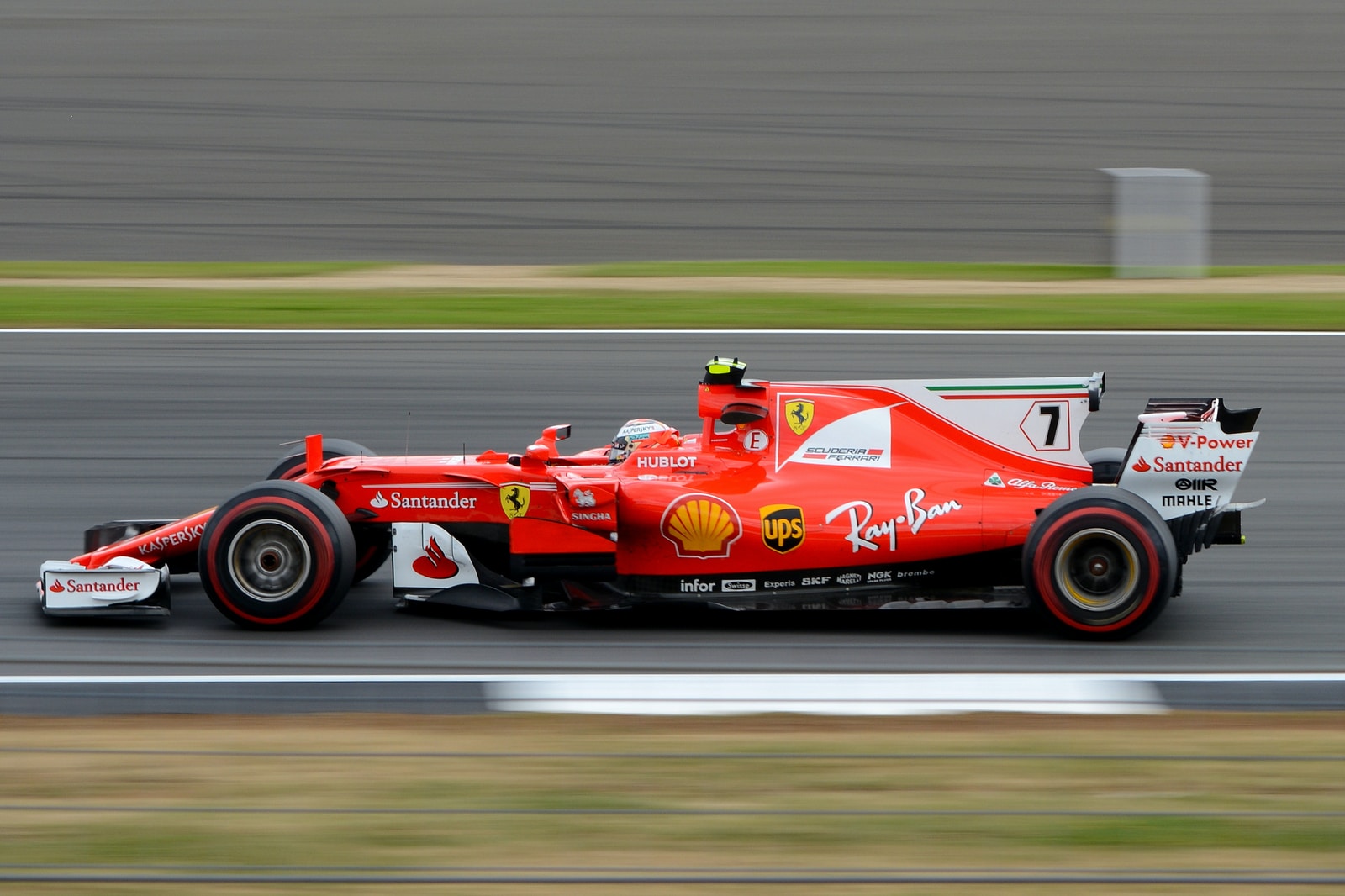 speeding formula-1 race car on race track during day