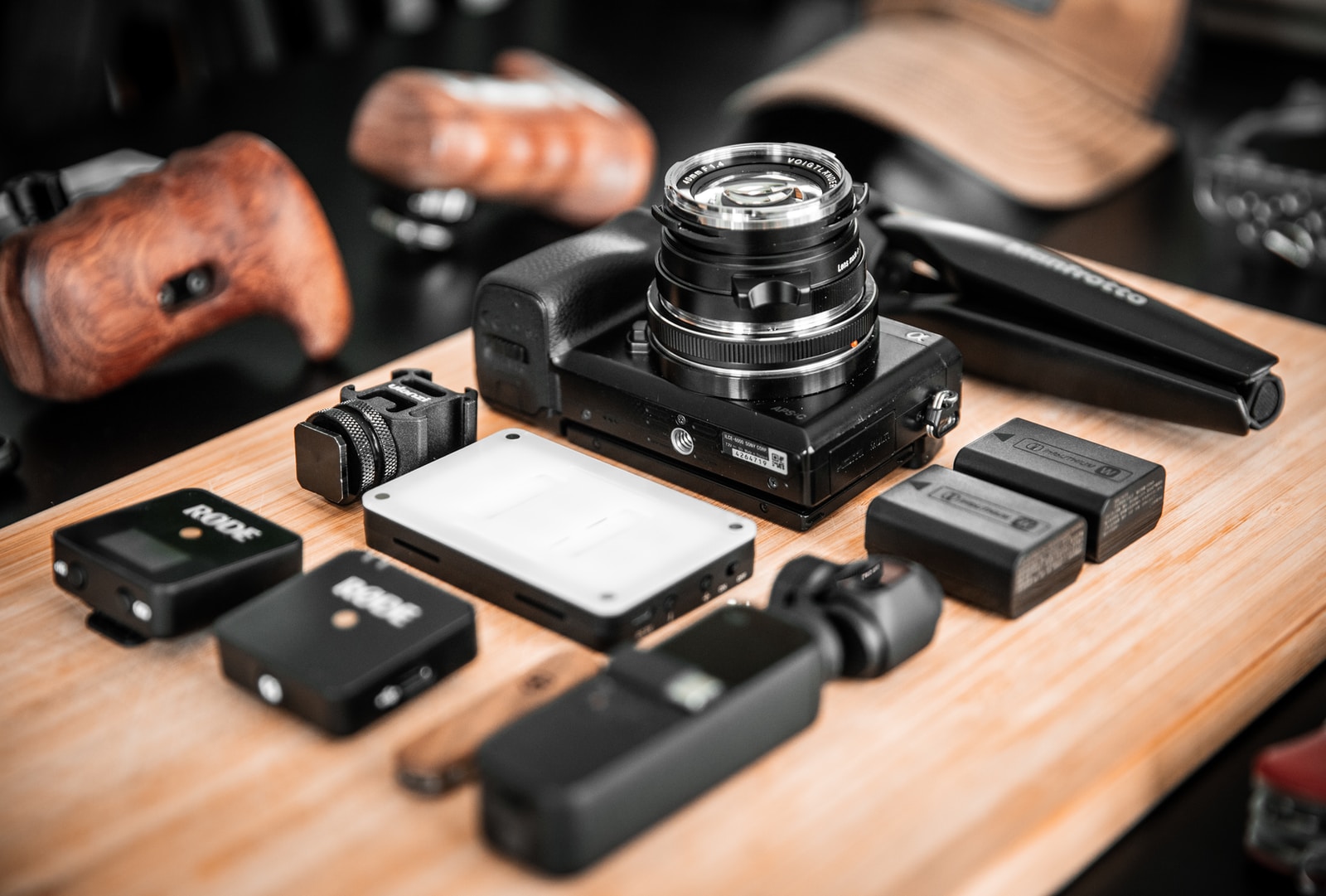 black dslr camera on brown wooden table