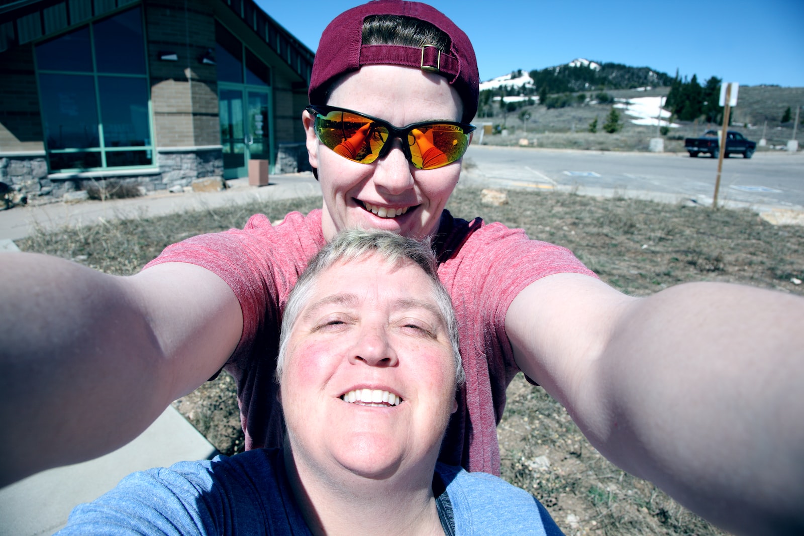 two men taking selfie in lawn